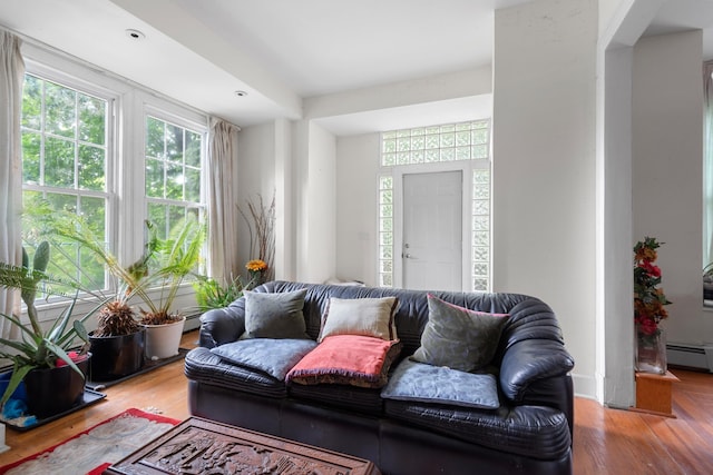 1208 River Rd, Edgewater, NJ 07020 - living area featuring a baseboard radiator and wood finished floors