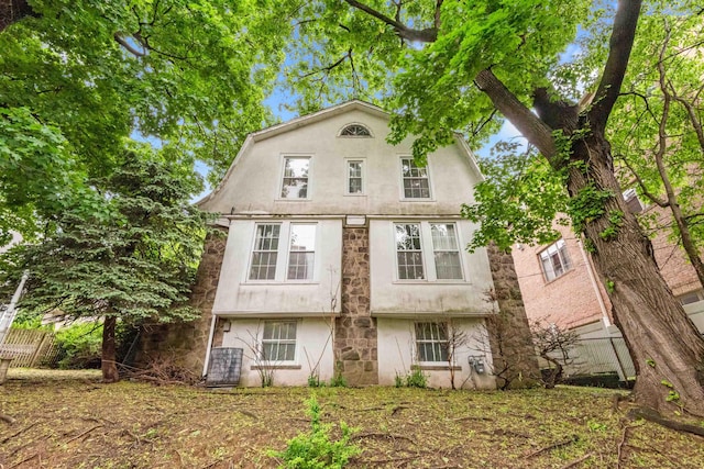1208 River Rd, Edgewater, NJ 07020 - view of front facade with stucco siding and fence