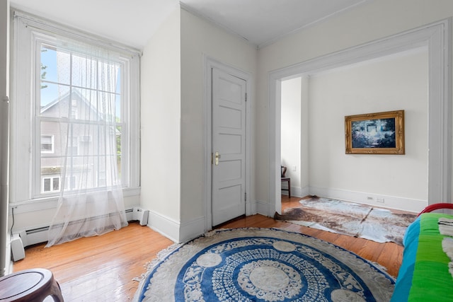 1208 River Rd, Edgewater, NJ 07020 - bedroom with baseboards, baseboard heating, and hardwood / wood-style flooring