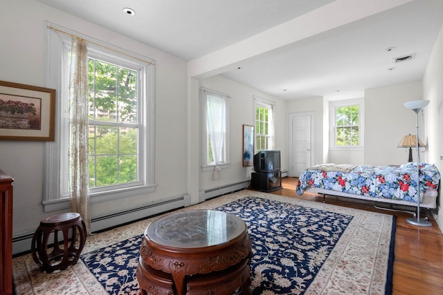 1208 River Rd, Edgewater, NJ 07020 - bedroom featuring visible vents, multiple windows, and baseboard heating