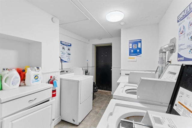 109 Erie St Unit 4L, Jersey City, NJ 07302 - community laundry room with separate washer and dryer and a wainscoted wall