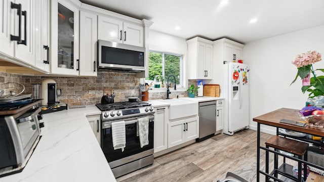 149 Hickory St, Kearny, NJ 07032 - kitchen with appliances with stainless steel finishes, decorative backsplash, white cabinets, and recessed lighting
