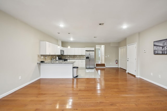 1160 Summit Ave Unit 2, Jersey City, NJ 07307 - kitchen with appliances with stainless steel finishes, backsplash, white cabinetry, light wood-style flooring, and recessed lighting