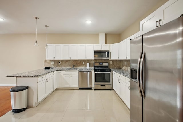 1160 Summit Ave Unit 2, Jersey City, NJ 07307 - kitchen with appliances with stainless steel finishes, a peninsula, backsplash, white cabinets, and recessed lighting