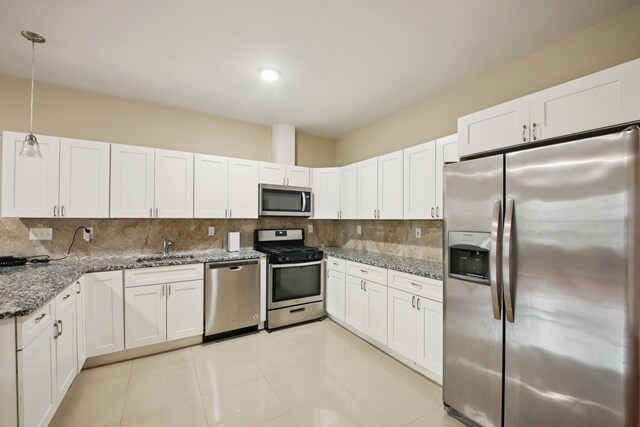 1160 Summit Ave Unit 2, Jersey City, NJ 07307 - kitchen featuring stainless steel appliances, tasteful backsplash, white cabinets, and stone counters