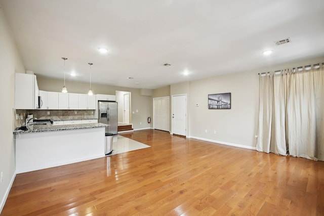 1160 Summit Ave Unit 2, Jersey City, NJ 07307 - kitchen with appliances with stainless steel finishes, tasteful backsplash, light wood finished floors, recessed lighting, and white cabinetry