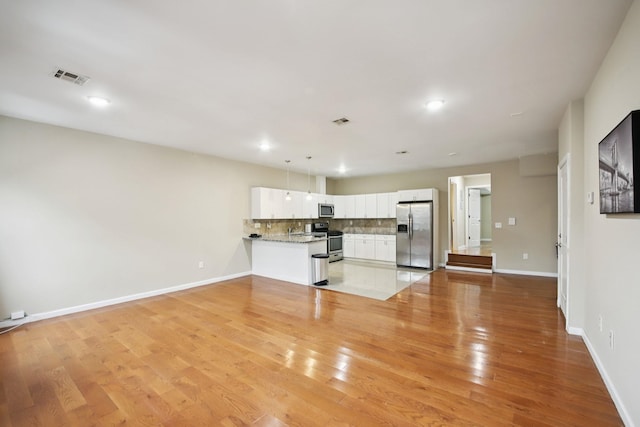 1160 Summit Ave Unit 2, Jersey City, NJ 07307 - unfurnished living room with light wood-type flooring and recessed lighting
