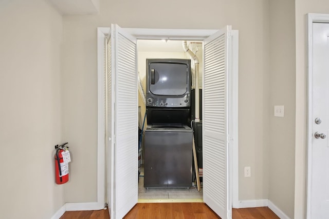 1160 Summit Ave Unit 2, Jersey City, NJ 07307 - laundry room with stacked washer and clothes dryer and wood finished floors