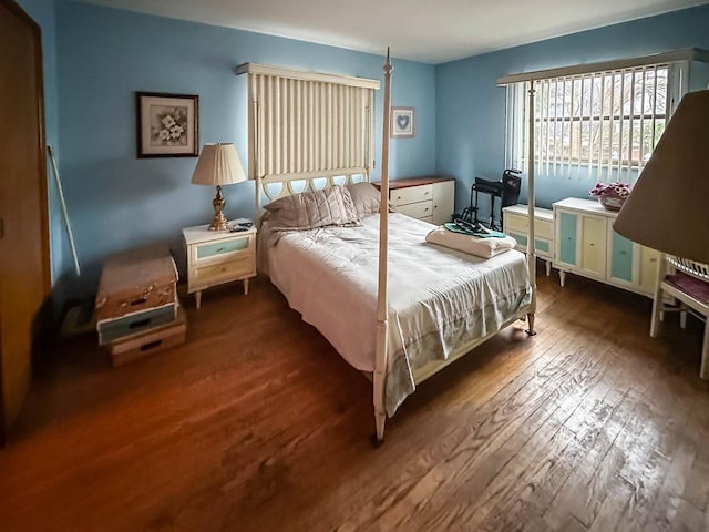 bedroom with hardwood / wood-style flooring