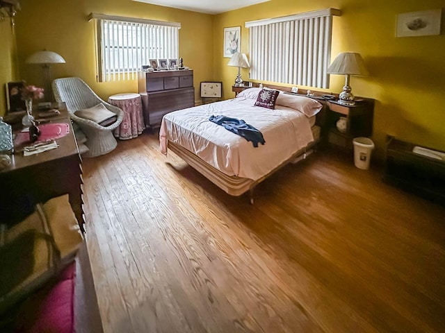 bedroom with wood-type flooring