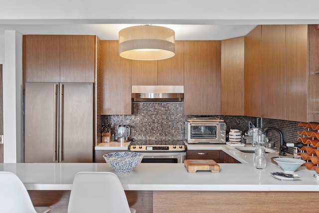 300 Newark St Unit 8G, Hoboken, NJ 07030 - kitchen with ventilation hood, electric range, a sink, light countertops, and backsplash