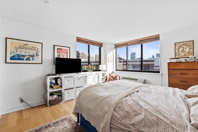 300 Newark St Unit 8G, Hoboken, NJ 07030 - bedroom with light wood-type flooring and baseboards