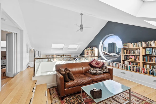 300 Newark St Unit 8G, Hoboken, NJ 07030 - living room with a skylight, a ceiling fan, wood finished floors, vaulted ceiling, and a city view