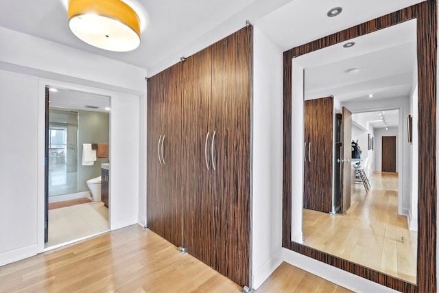 300 Newark St Unit 8G, Hoboken, NJ 07030 - hall featuring light wood finished floors and baseboards