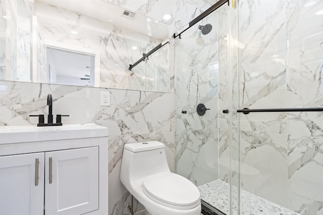 133 W 4th St, Bayonne, NJ 07002 - bathroom featuring tile walls, vanity, and a marble finish shower