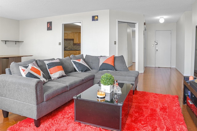 Harmon Cove Tower 426, Secaucus, NJ 07094 - living room with wood finished floors and a textured ceiling