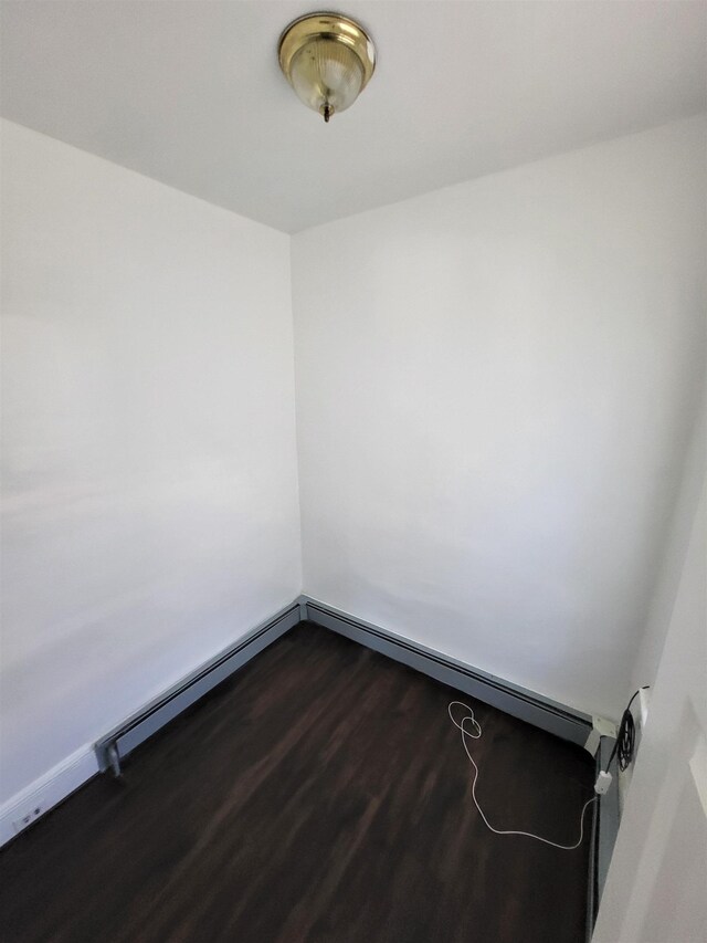 137 76th St, North Bergen, NJ 07047 - spare room with dark wood-style flooring