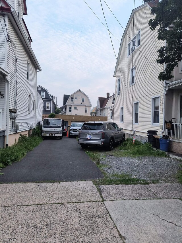 137 76th St, North Bergen, NJ 07047 - view of asphalt driveway featuring a residential view