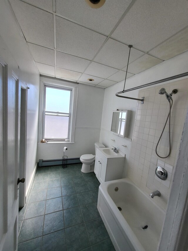 137 76th St, North Bergen, NJ 07047 - full bath featuring a baseboard heating unit, toilet, vanity, a drop ceiling, and shower / tub combination