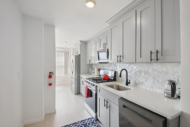 10 Huron Ave Unit 11D, Jersey City, NJ 07306 - kitchen with appliances with stainless steel finishes, decorative backsplash, light stone counters, and recessed lighting