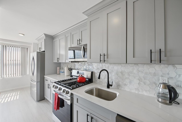 10 Huron Ave Unit 11D, Jersey City, NJ 07306 - kitchen with stainless steel appliances, gray cabinets, decorative backsplash, and light stone countertops