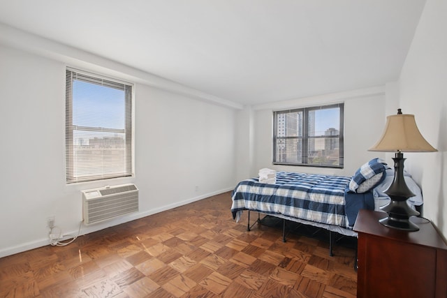 10 Huron Ave Unit 11D, Jersey City, NJ 07306 - bedroom featuring baseboards and an AC wall unit