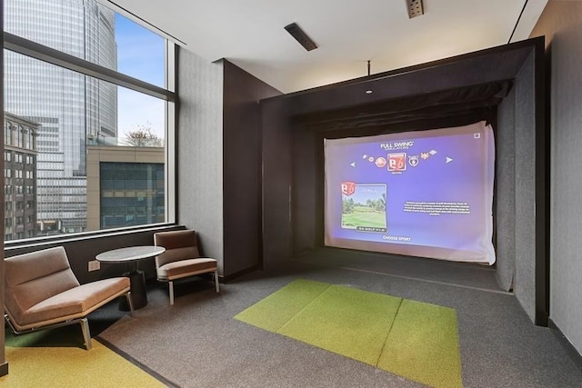 99 Hudson St Unit 601, Jersey City, NJ 07302 - carpeted home theater with golf simulator