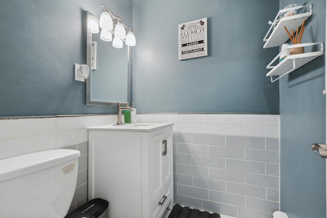 60 Wilson Ave, Kearny, NJ 07032 - half bath featuring toilet, tile walls, vanity, and wainscoting
