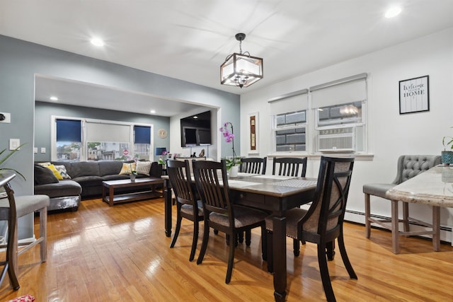 60 Wilson Ave, Kearny, NJ 07032 - dining space featuring light wood-style flooring, a baseboard radiator, a chandelier, cooling unit, and recessed lighting