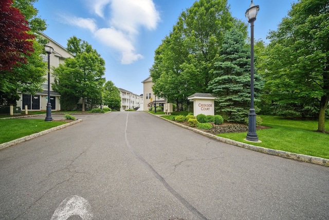 28 Creekside Ct Unit 28, Secaucus, NJ 07094 - view of asphalt street featuring street lights and curbs