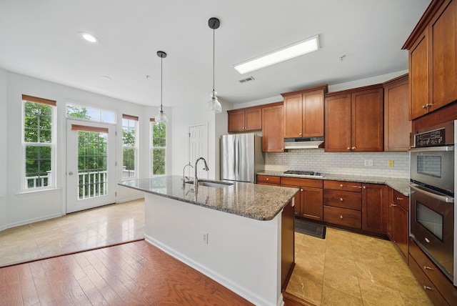 28 Creekside Ct Unit 28, Secaucus, NJ 07094 - kitchen with a sink, appliances with stainless steel finishes, under cabinet range hood, stone counters, and tasteful backsplash