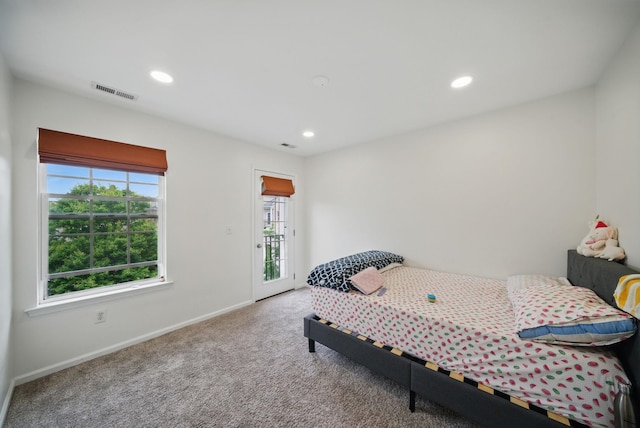 28 Creekside Ct Unit 28, Secaucus, NJ 07094 - bedroom with multiple windows, access to exterior, baseboards, carpet flooring, and recessed lighting