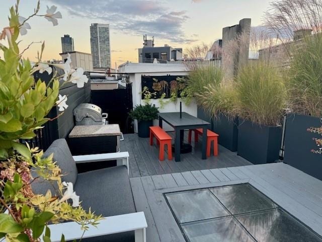 patio terrace at dusk with outdoor dining area