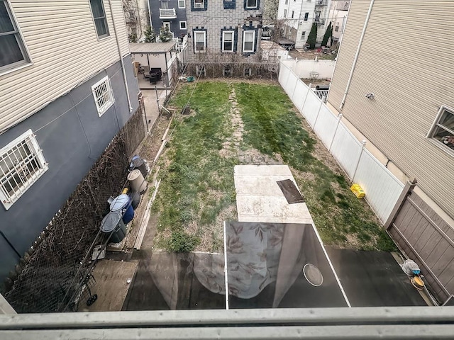 view of yard with a fenced backyard