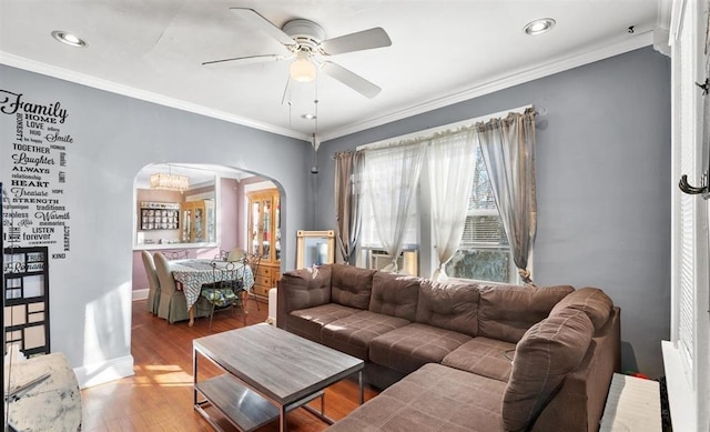 living room featuring ornamental molding, radiator heating unit, hardwood / wood-style flooring, and ceiling fan