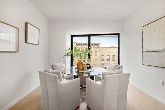 413 Monroe St Unit 200, Hoboken, NJ 07030 - dining room featuring light wood-style flooring and baseboards
