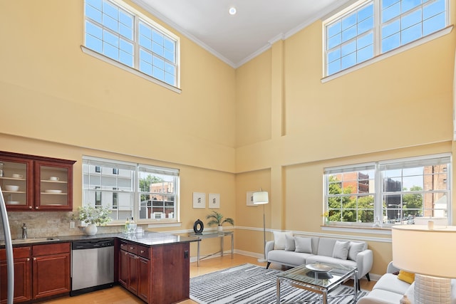 769 Montgomery St Unit 211, Jersey City, NJ 07306 - bar area featuring stainless steel dishwasher, a towering ceiling, healthy amount of natural light, crown molding, and tasteful backsplash