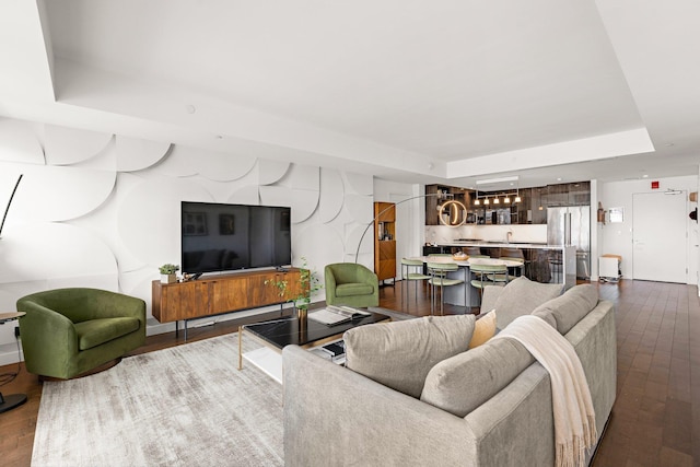800 Ave At Port Imperial Unit 403, Weehawken, NJ 07086 - living room featuring a tray ceiling and dark wood-style floors