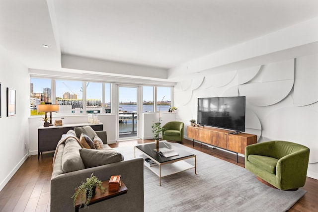 800 Ave At Port Imperial Unit 403, Weehawken, NJ 07086 - living area featuring plenty of natural light, a raised ceiling, and wood finished floors