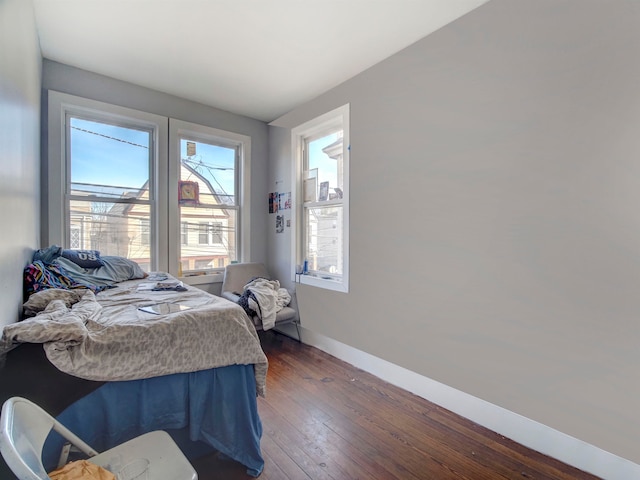 bedroom featuring dark hardwood / wood-style floors