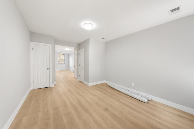 spare room featuring light hardwood / wood-style floors