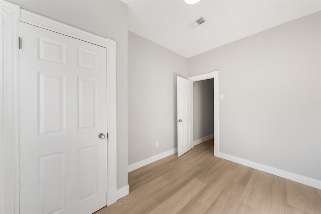 unfurnished bedroom featuring light wood-type flooring