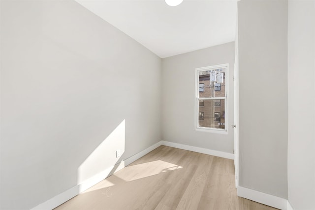 spare room featuring light hardwood / wood-style flooring