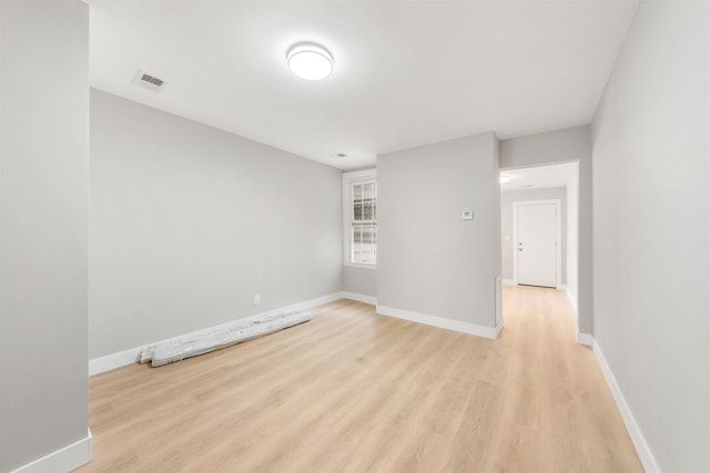 unfurnished room featuring light wood-type flooring