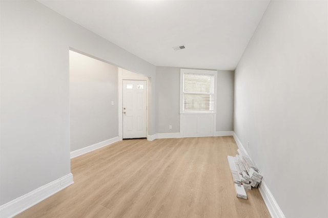 spare room with light hardwood / wood-style floors