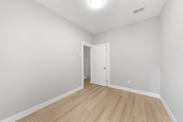 unfurnished room with light hardwood / wood-style flooring