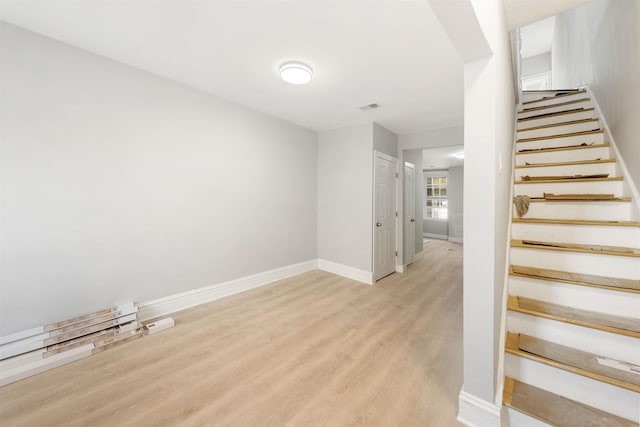 staircase featuring hardwood / wood-style flooring