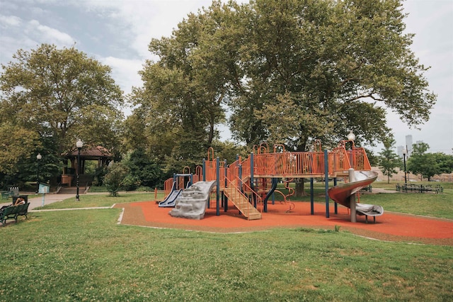 view of play area featuring a lawn