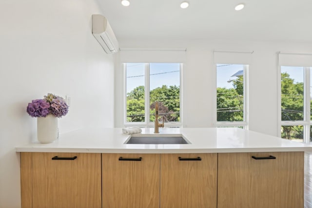 kitchen with sink and a wall unit AC