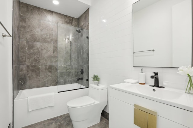 bathroom with  shower combination, tile walls, vanity, and toilet